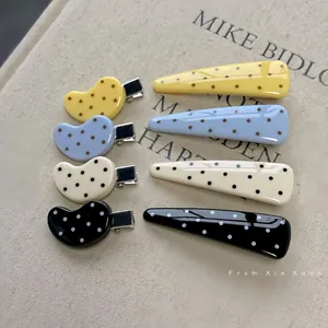 Chic yellow polka dot hair clip set in acetate finish for minimalist summer hair styling