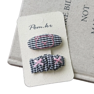 Set of 2 grid pattern hair clips with pink bear embroidery and ribbon bows