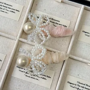 Barrettes à cheveux élégantes avec nœuds en perles rose et champagne en tulle