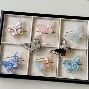 French iridescent acetate butterfly hair clips in various marble and floral patterns