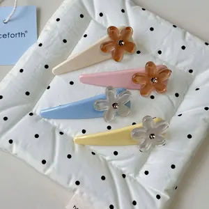Elegant floral hair clips set in four colors with acrylic flowers and rhinestones