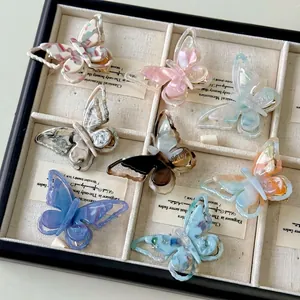 French iridescent acetate butterfly hair clips in diverse marble patterns set of eight