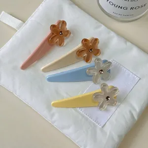 Elegant four-piece floral hair clip set in pastel colors for summer hairstyles