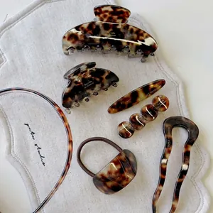 Elegant tortoiseshell acetate hair claw clip set with classic amber leopard print pattern