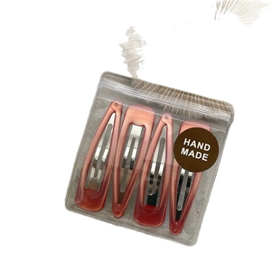 Set of four Korean style gradient resin hair clips with handmade logo packaging
