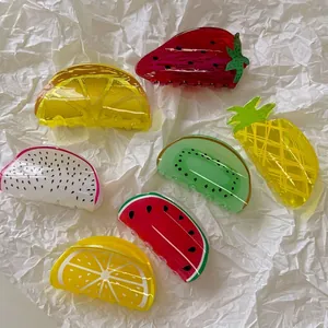 Colorful fruit shaped hair claws set with watermelon and strawberry acrylic patterns