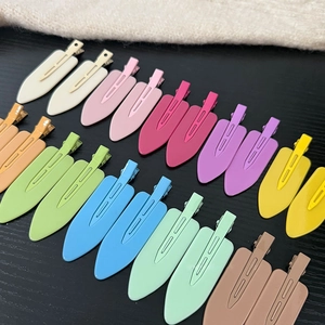20-piece set of colorful matte candy color hair clips arranged on a dark wood background