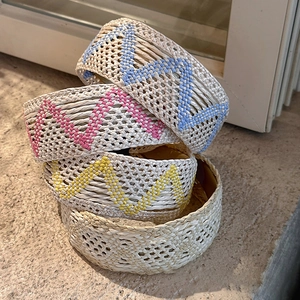 Set of four bohemian woven headbands with geometric patterns and raffia texture style