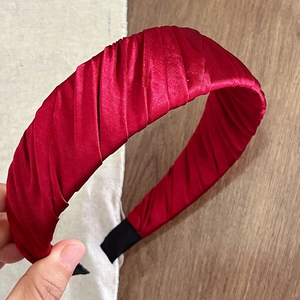 Detailed view of wine red satin pleated headband with premium non-slip inner lining