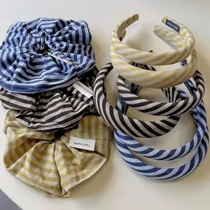 Striped headband and scrunchie set in navy blue, brown, and yellow textured fabric