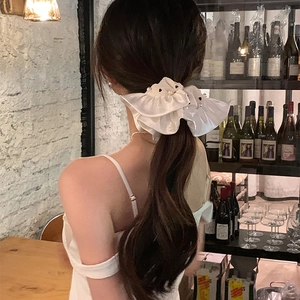 French style satin scrunchie with pearls for elegant low ponytail hair styling