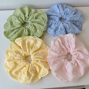 Set of four pastel eyelet embroidery hair scrunchies in green, blue, yellow, and pink