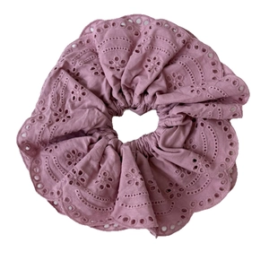 Pink eyelet embroidery scrunchie with ruffled edges in a minimalist French style