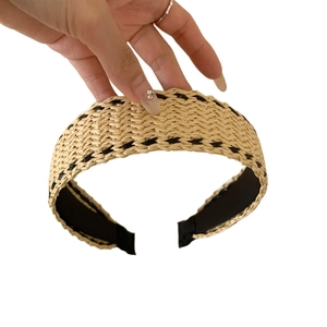 Bohemian wide straw headband with black wavy pattern for a summer beach vacation look