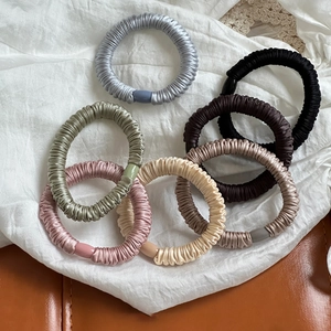 Set of 7 silk satin hair scrunchies with pleated texture in elegant Morandi colors