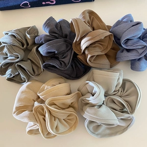 Set of 6 assorted solid color ruffled scrunchies in earth tones for versatile hairstyling