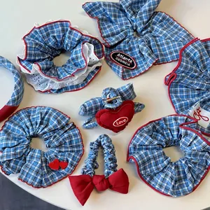 Blue and white plaid scrunchies and hair clips set with red Atlanta Georgia embroidery