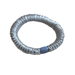 Minimalist silver grey layered satin scrunchie with smooth silk texture and plastic clasp