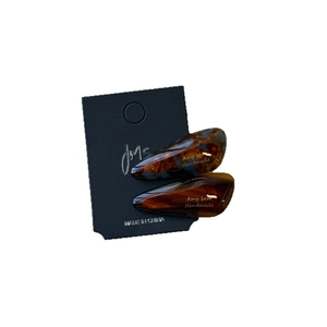 Set of 2 tortoise shell acetate drop hair clips with elegant gold lettering on black card