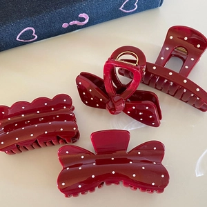 French vintage red hair claw set with white polka dots for elegant hairstyles
