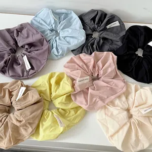 Set of 8 large cream-colored matte chiffon scrunchies in various Morandi pastel colors