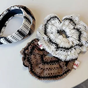 Knitted hollow stripe hair tie and headband set in black, white, and brown tones