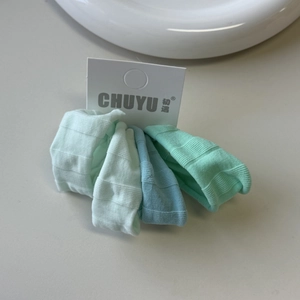 Close-up of Morandi green and blue elastic ice silk hair ties with ribbed texture
