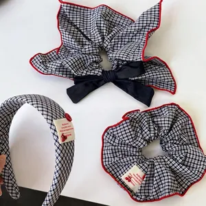 Navy blue gingham hair accessories set featuring bow scrunchies and wide headband with red trim