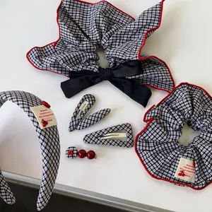 Retro navy plaid hair accessory set including headband and bow scrunchie with red accents