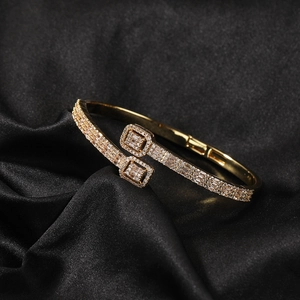 Elegant gold-plated open bangle with layered square motifs and micro-pave white zircons