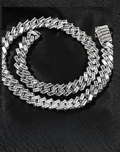 Macro detail of silver Cuban chain featuring T-shaped baguette cubic zirconia stones
