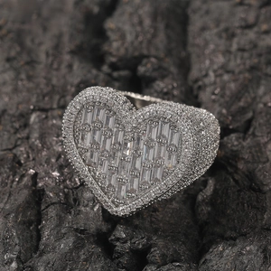 Close-up of heart-shaped hip-hop ring with micro-pave baguette and round zircons