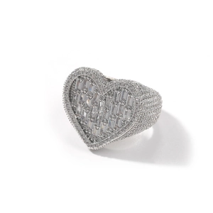 Detailed close-up of heart-shaped silver ring with baguette and pave-set zircons