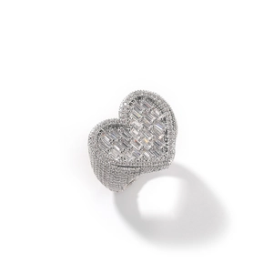 Detail of silver heart ring with pavé-set baguette and round cubic zirconia stones