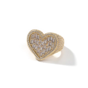Macro detail of luxury 18k gold plated ring with heart shaped cubic zirconia pavé