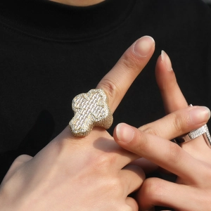 Detail of hip hop style gold cross ring with micro-pave cubic zirconia crystals
