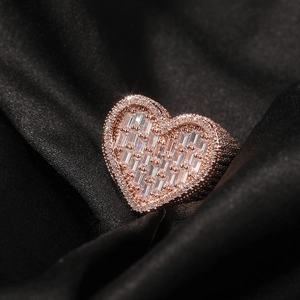Macro shot of iced out heart ring with pave zircon stones in a rose gold finish