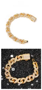 Detailed view of a gold hip-hop Cuban link bracelet with iced-out pavé crystals