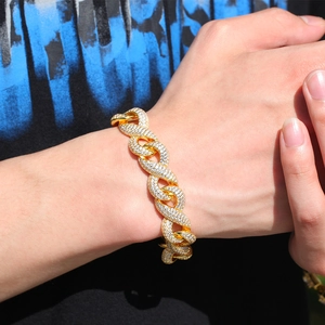 Close-up of golden infinity link bracelet with iced-out cubic zirconia stones