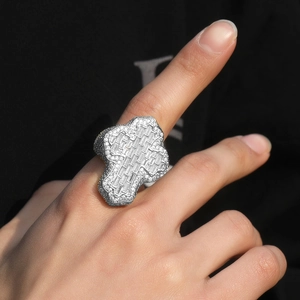 Detailed view of hip hop cross ring with micro-paved zircons on male hand