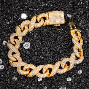 Luxurious gold hip-hop bracelet with micro-paved diamonds on black stone background