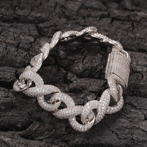 Luxurious silver twisted Cuban chain bracelet with pave diamonds and secure box clasp