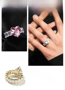 Close-up of heart-shaped zircon rings with baguette-cut stones in gold and silver finish