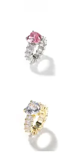 Detail view of heart-shaped zircon rings in gold and silver finish with rectangular stones