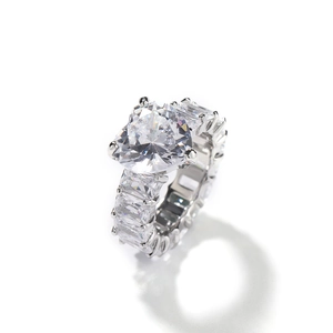 Silver heart cut zirconia ring with baguette side stones on white background