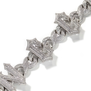 Icy silver Cuban chain necklace with iced-out infinity symbol and crown pendant