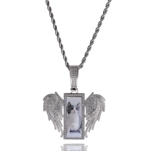 Detailed view of silver rectangular wing photo pendant with crystals on rope chain