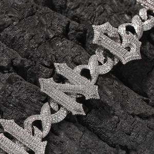 Detailed close-up of iced out hip hop infinity letter pendant with cubic zirconia stones
