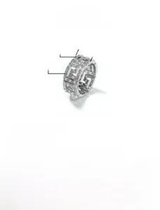 Detail of silver brass ring with Greek pattern and cubic zirconia inlays