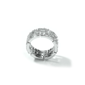 Macro shot of silver hip-hop ring with inlaid square cubic zirconia and G-shaped hollow design